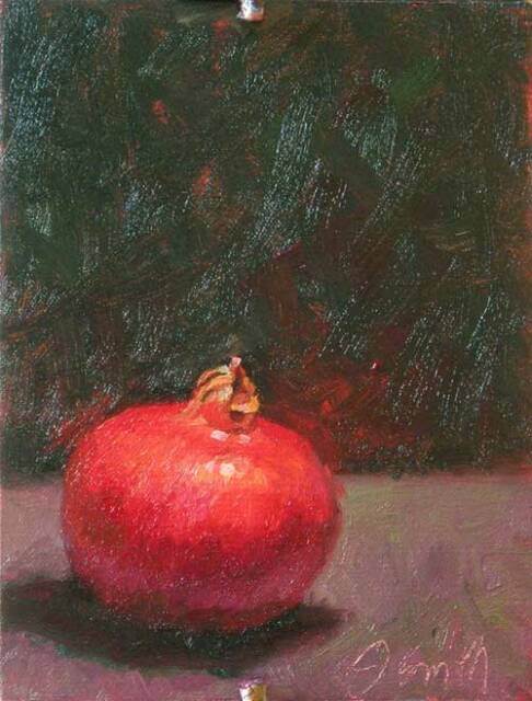 Oil painting showing a red pomegranate sitting on a wood table top